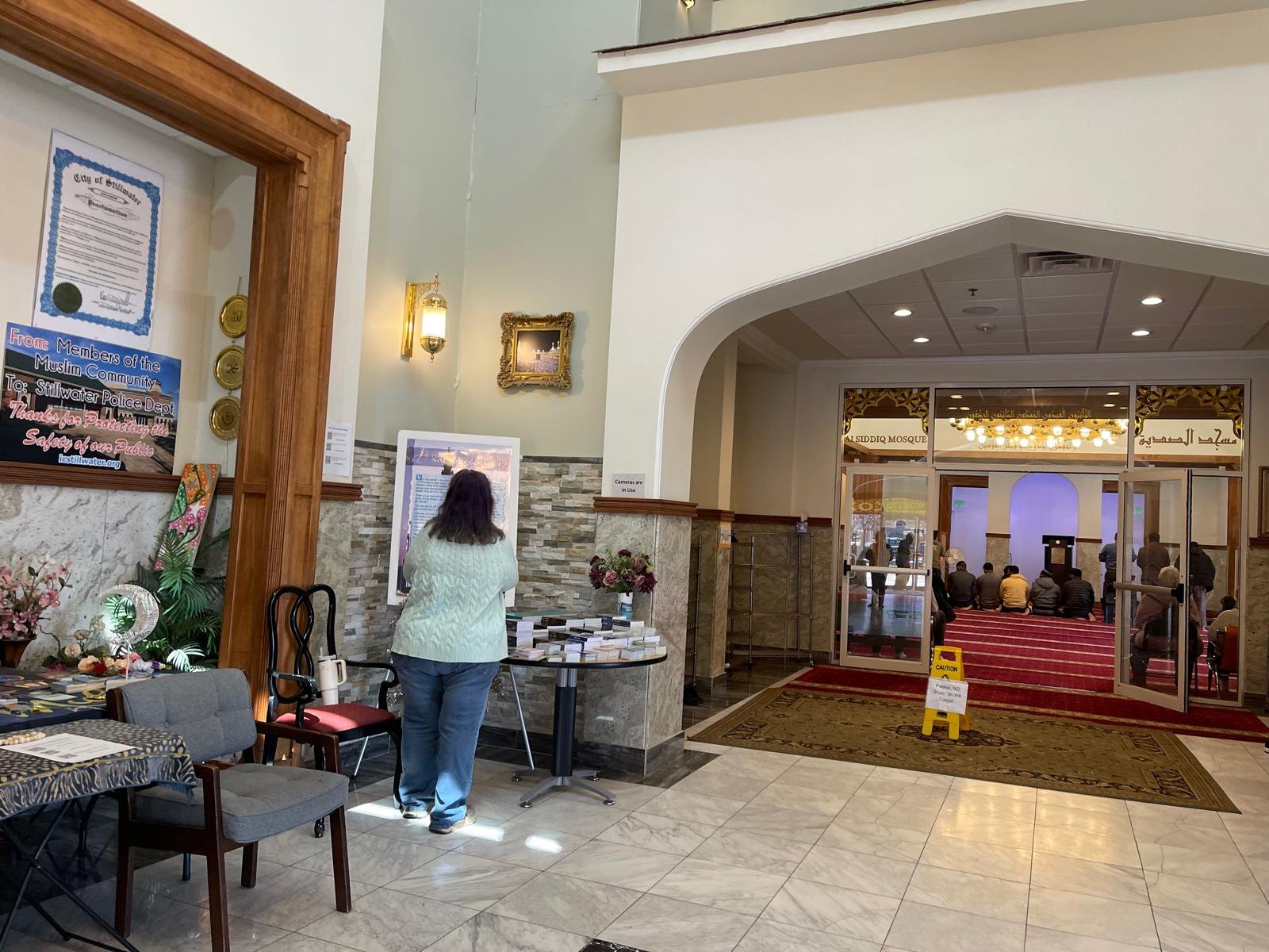 Visitors observing prayer hall